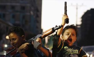 Children in Gaza holding real guns