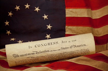 USA Declaration of Independence Lying on Grungy Betsy Ross Flag