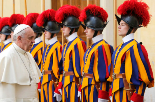 Pope Francis leaves past Swiss guards