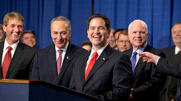 There are smiles all around as immigration reform legislation is outlined by the Senate's bipartisan "Gang of Eight", on Capitol Hill in Washington, Thursday, April 18, 2013. From left to right are Sen. Jeff Flake, R-Ariz., Sen. Chuck Schumer, D-N.Y., Sen. Marco Rubio, R-Fla., and Sen. John McCain, R-Ariz. The legislation would dramatically remake the U.S. immigration system, ushering in new visa programs for low- and high-skilled workers, requiring a tough new focus on border security, instituting a new requirement for all employers to check the legal status of their workers, and installing a path to citizenship for 11 million immigrants in the country illegally. (AP Photo/J. Scott Applewhite)